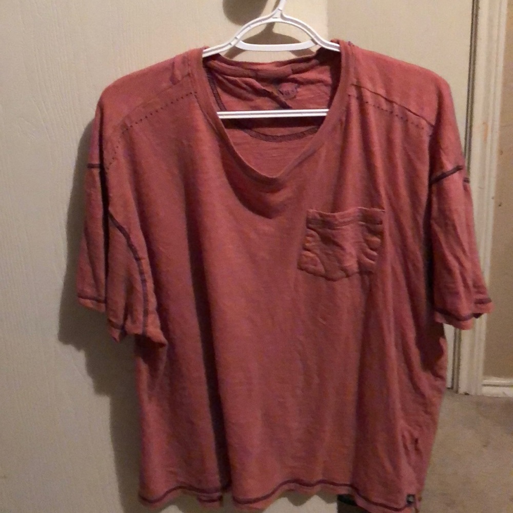 I am selling a men’s t-shirt that is pink shirt